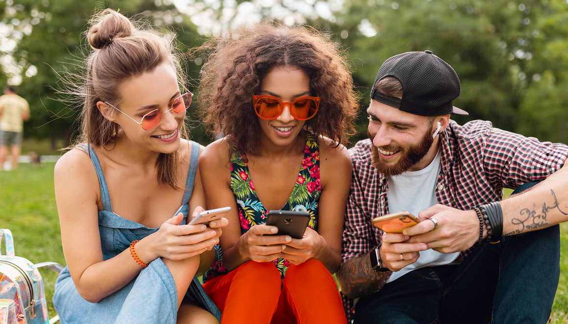 Friends looking at phone together
